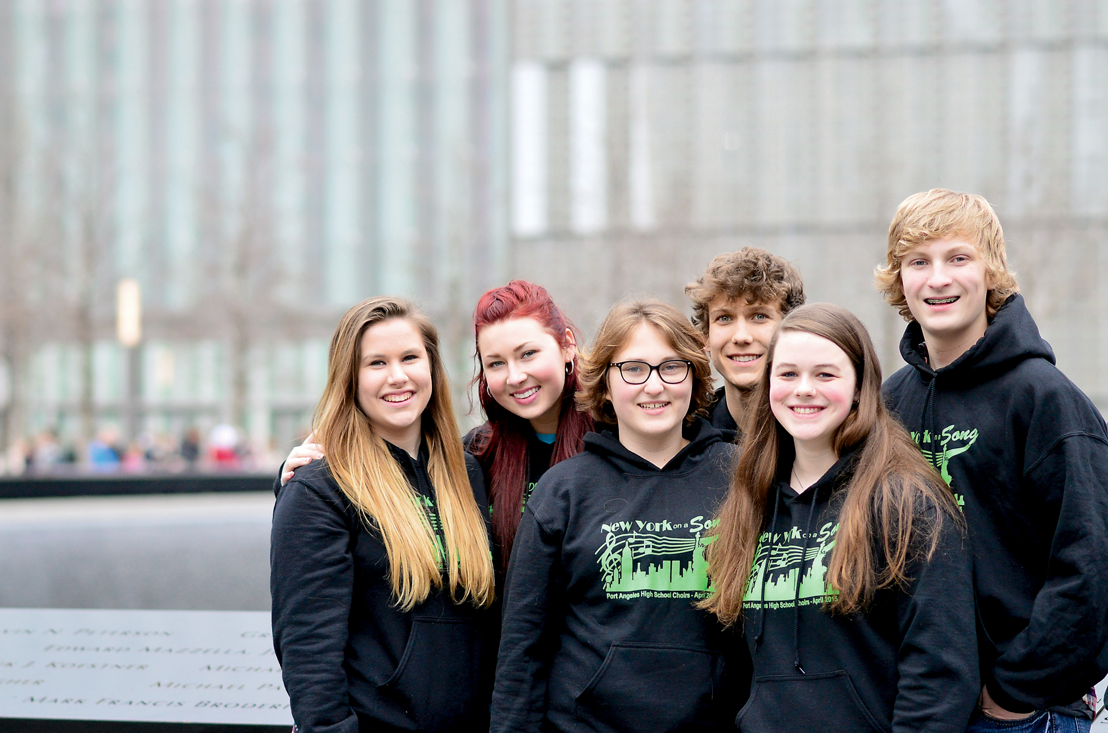 Following their performance on the 9/11 Memorial plaza are Port Angeles High School choir members