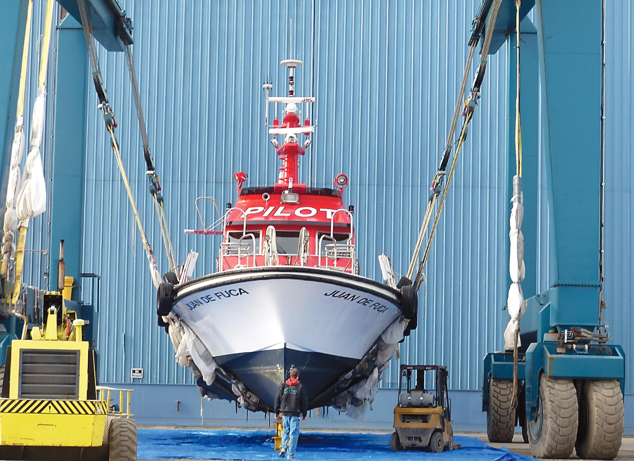 The Puget Sound Pilots boat Juan de Fuca is shown in the slings of the Platypus Marine Inc. TraveLift. —Photo by David G. Sellars/for Peninsula Daily News ()