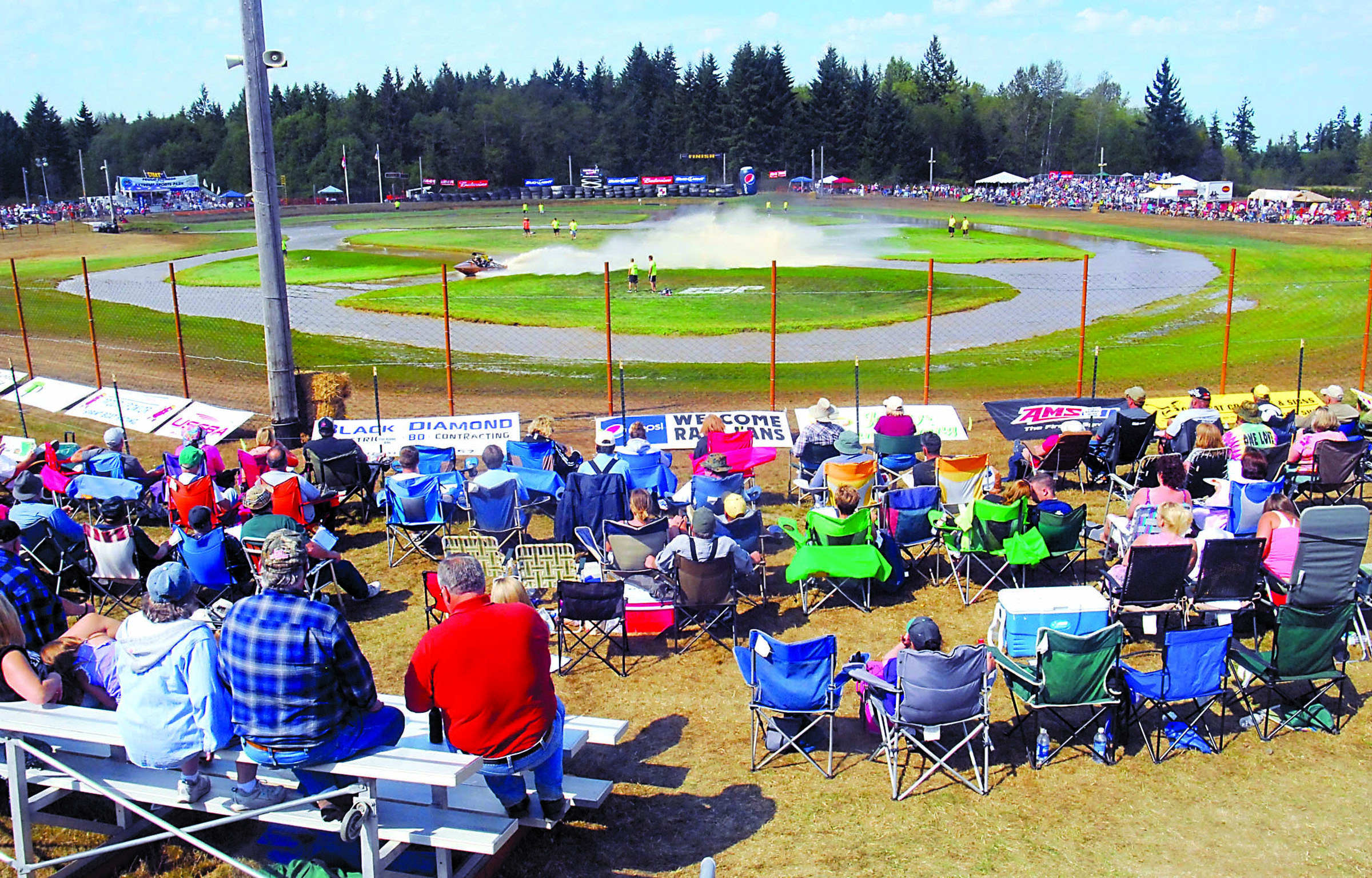 Sprint boat fans watch a boat make its way around the Extreme Sports Park course during national championship races in 2012. A2Z Enterprises