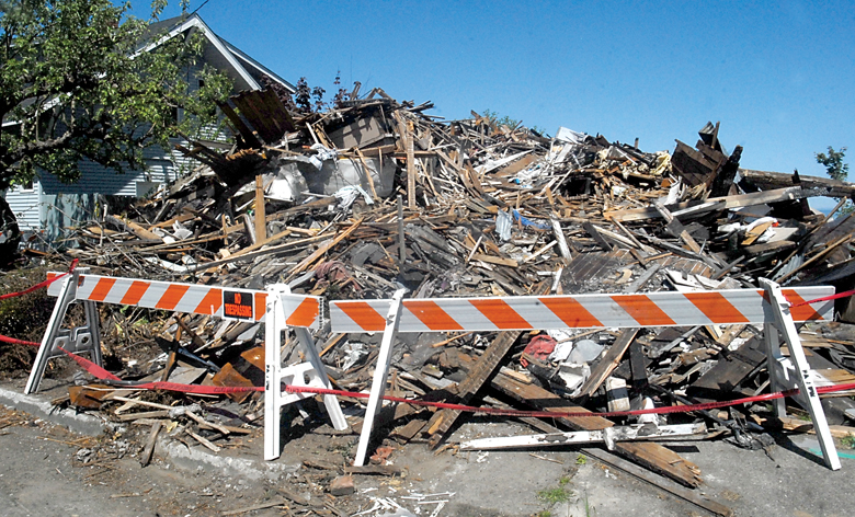 A pile of rubble is all that remains of a house at 715 E. Caroline St.