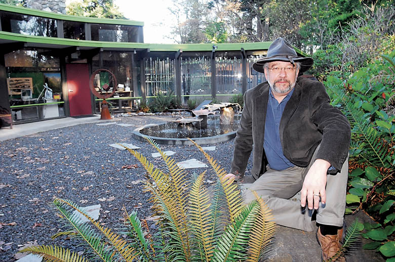 Port Angeles Fine Arts Center director Jake Seniuk sits in the courtyard of the center in this December 2011 file photograph. — Keith Thorpe/Peninsula Daily News ()