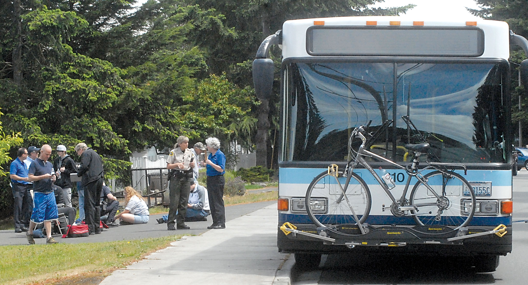 Medical personnel and law enforcement investigate the scene after a passenger on a Clallam Transit bus attacked passengers and the bus driver in the 1600 block of West 16th Street near the Clallam County Fairgrounds in Port Angeles on Saturday. — Keith Thorpe/Peninsula Daily News ()
