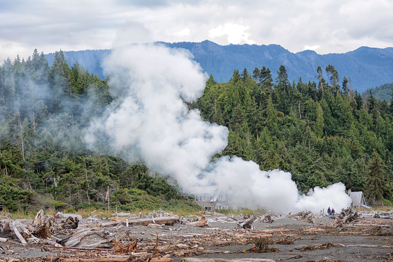A beach log fire sends up a plume of smoke Tuesday morning near Place Road west of Port Angeles. (Jay Cline/Clallam County Fire District No. 2)