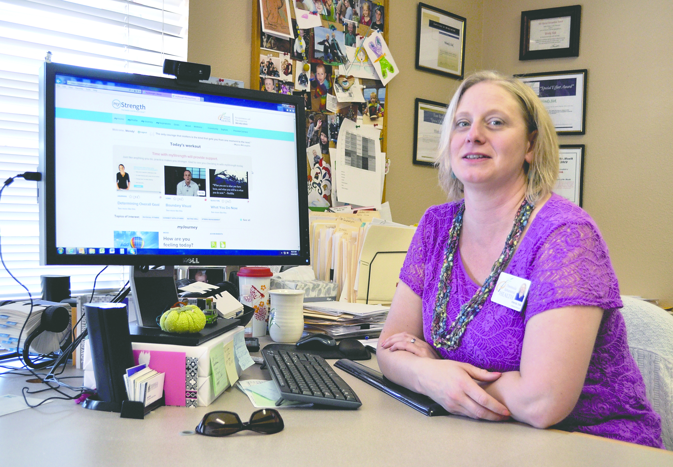 Wendy Sisk displays MyStrength’s portal page on her computer at Peninsula Behavioral Health in Port Angeles. — James Casey/Peninsula Daily News
