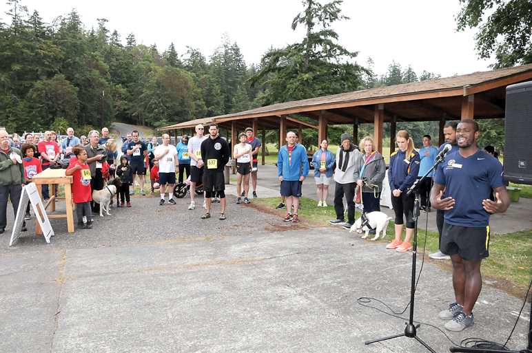 Shawn Ellison sings the national anthem before the start of the Deer Run last Saturday at Naval Magazine Indian Island. — Phillip L. Guerrero/Naval Magazine Indian Island ()