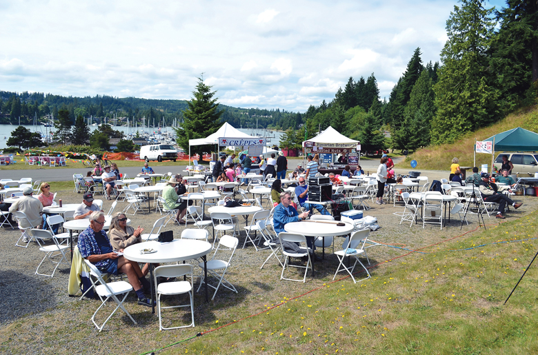 People begin to gather at the 2014 Port Ludlow Festival by the Bay for an afternoon's musical entertainment.