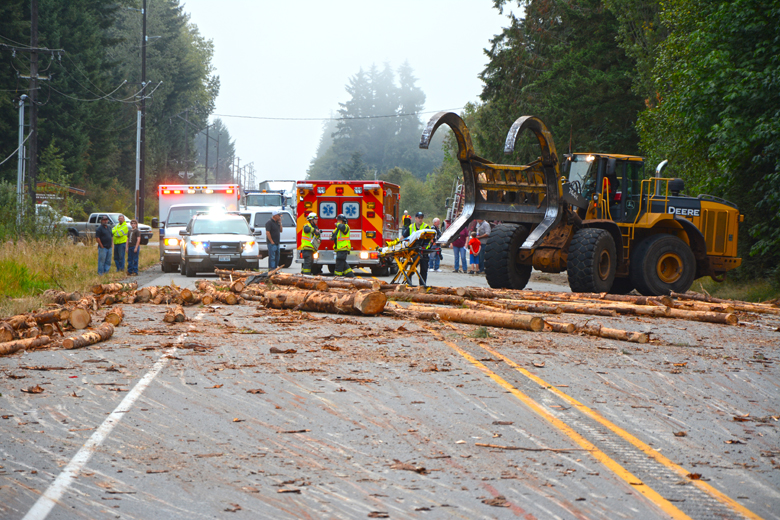 Clallam County Fire District No. 2 responds to a report of a log truck that lost its load on U.S. HIghway 101
