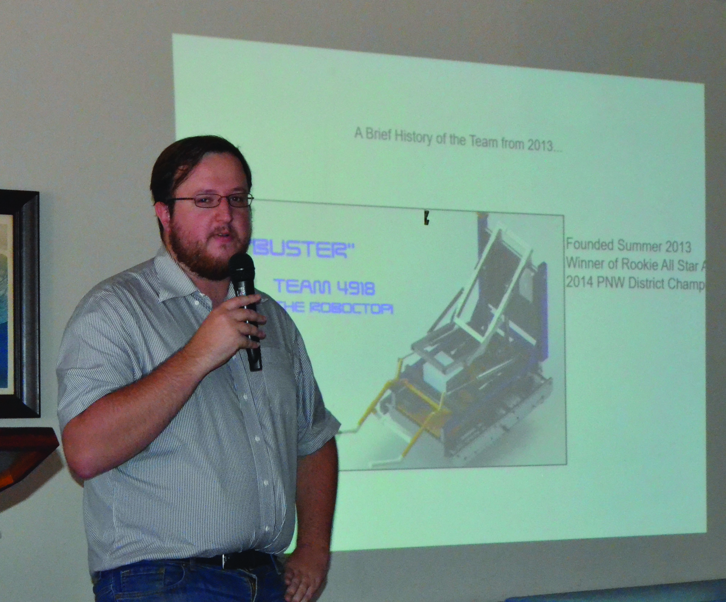 Port Townsend Robotics Team coach Austin Henry addresses the Jefferson County Chamber of Commerce on Monday
