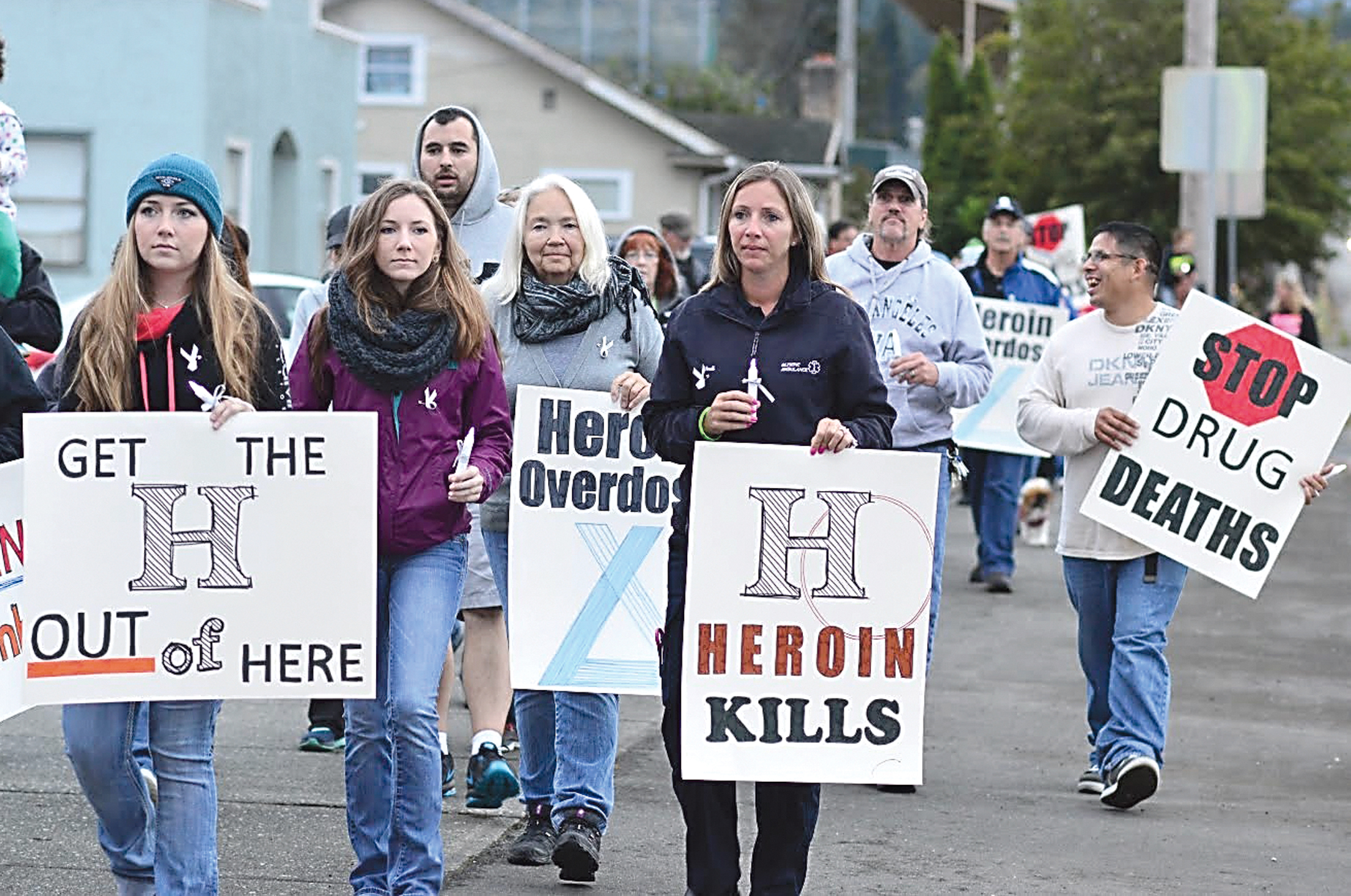 Monday evening's Overdose Awareness Vigil drew a crowd of people carrying battery-powered candles and signs protesting heroin's persistence in Port Angeles. Diane Urbani de la Paz/Peninsula Daily News