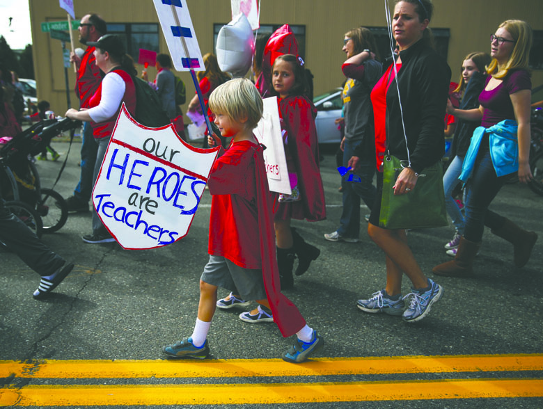 Supporters of striking Seattle teachers take part in a march and rally Tuesday in Seattle. The Associated Press