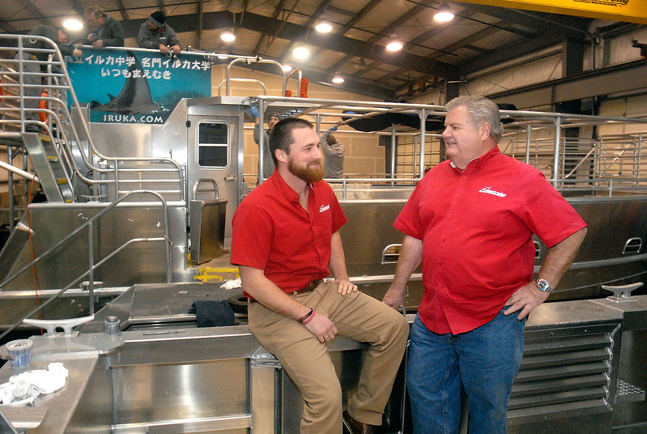 Armstrong Marine USA Inc., managing director Perry Knudson, left, and commercial sales manager Capt. Charlie Crane discuss operations at the boat fabrication shop east of Port Angeles. (Keith Thorpe/Peninsula Daily News)