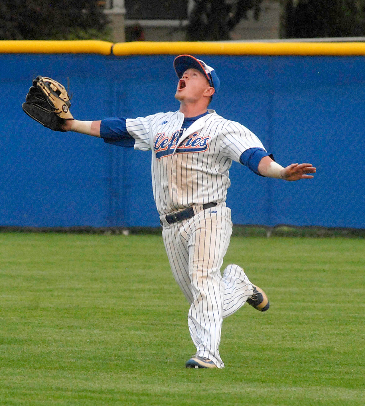 Keith Thorpe/Peninsula Daily News Lefties’ Benny Kaleiwahea calls for a fly ball during his team’s game last August against the Victoria Harbour Cats at Port Angeles Civic Field.