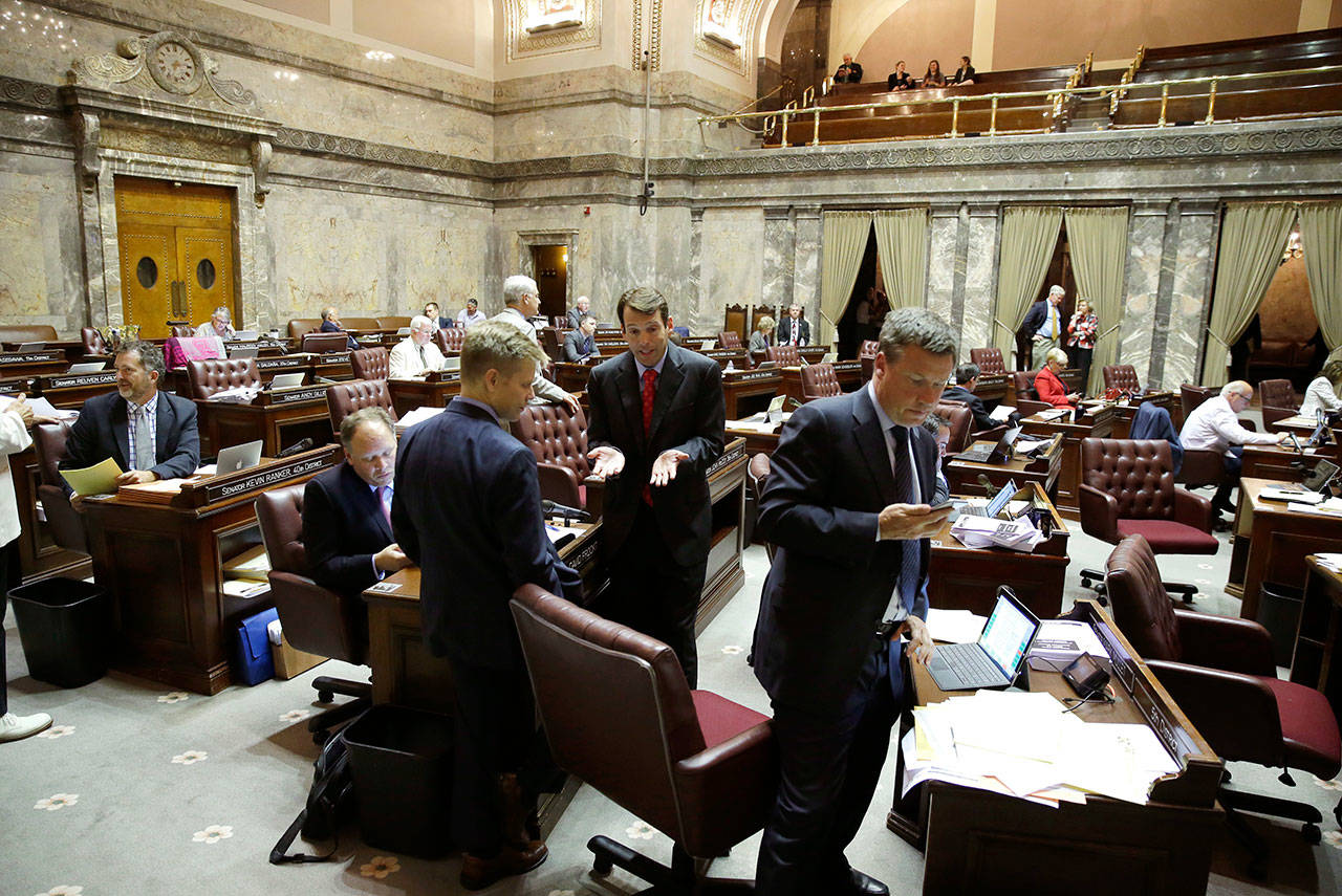 The public gallery is visible above the state Senate floor at upper right in the Capitol in Olympia in June. (The Associated Press)