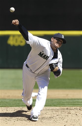 Felix Hernandez throws to a Tampa Bay Rays batter in the third inning of today's game. He faced the minimum 27 batters and struck out 12 of them. The Associated Press