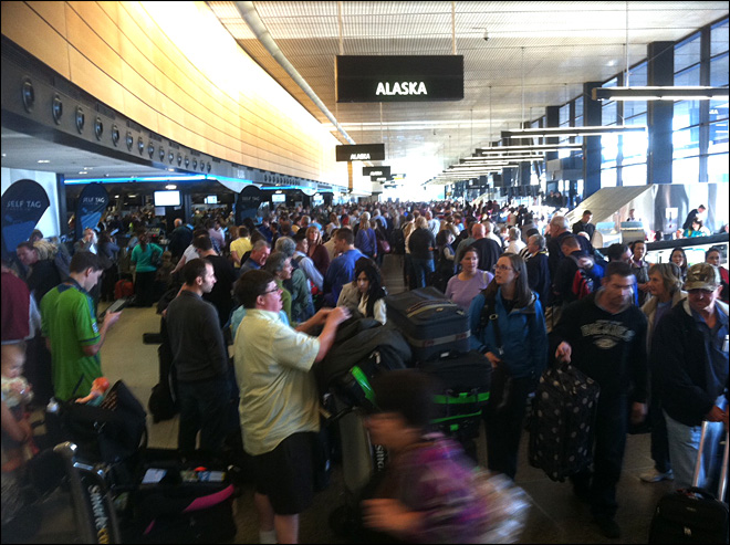 Long lines and passenger confusion abound near the Alaska Airlines ticketing area at Seattle-Tacoma International Airport this morning. KOMO News