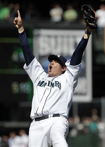 The Seattle Mariners' Felix Hernandez celebrates after throwing a perfect game at Safeco Field last season. The Associated Press