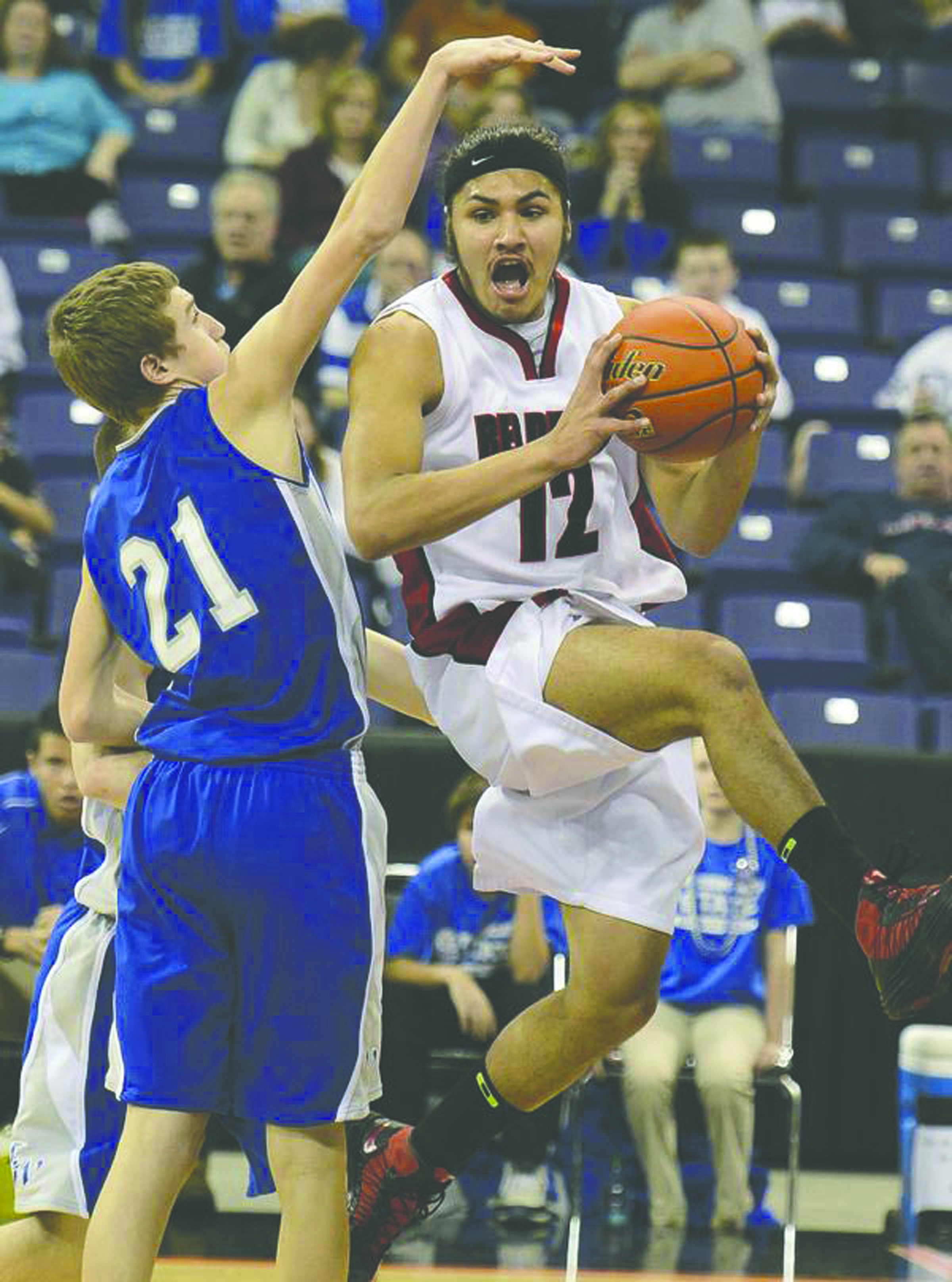 Neah Bay's Josiah Greene looks for a passing route as LaCrosse-Washtucna- Kahlotus' Joey Guske defends in the first half of their 1B boys state basketball semifinals game at Spokane Arena on Friday night. Colin Mulvany/The Spokesman-Review