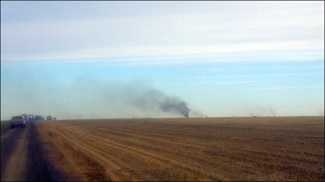 Smoke from a crashed military plane from NAS Whidbey Island rises from a farm field  in Eastern Washington this morning. KOMO