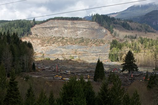 Search and rescue personnel continue the search for bodies buried in mud at the Oso landslide in rural Snohomish County. The Oregonian via The Associated Press (Click on photo to enlarge)
