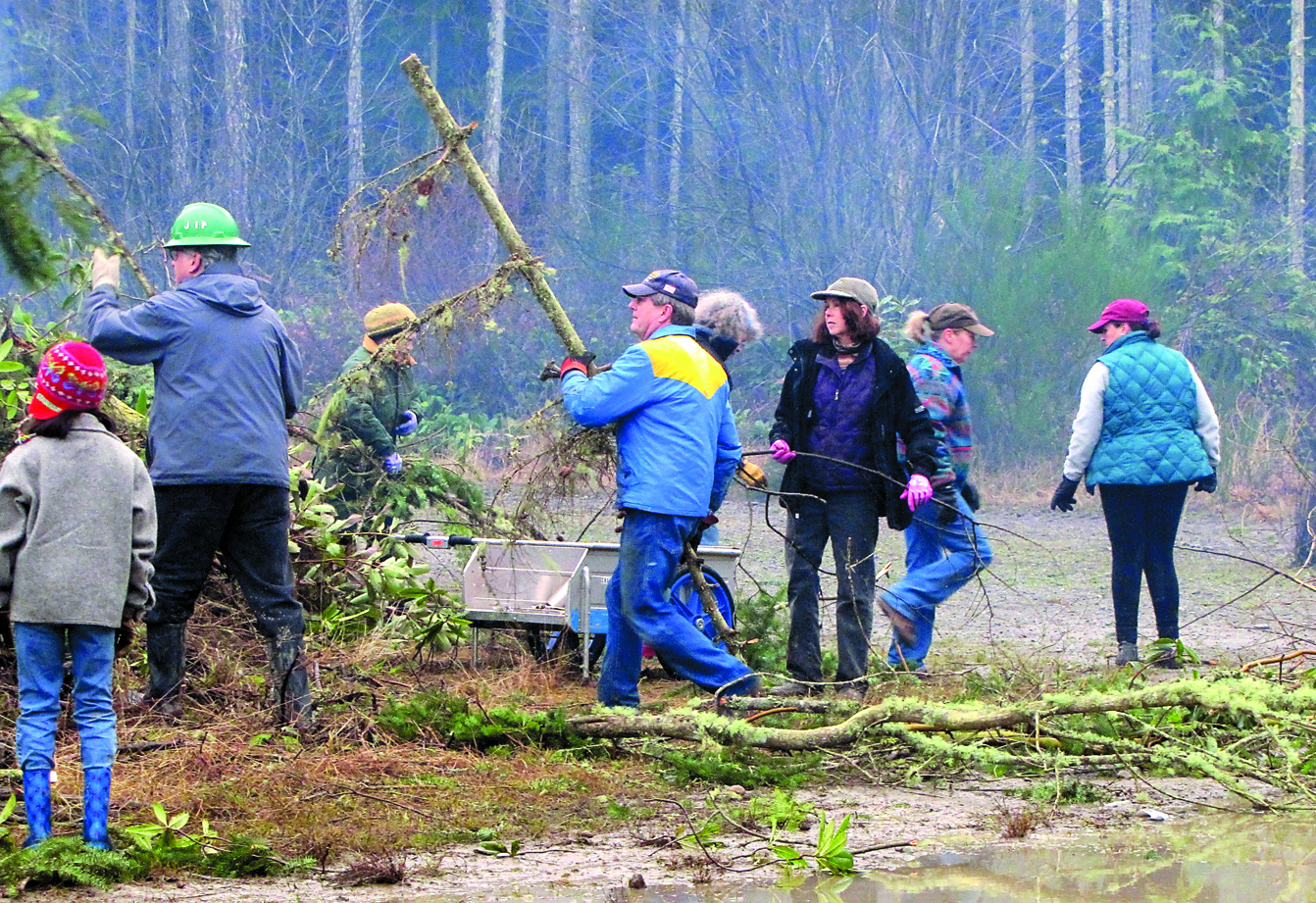 Members of the Jefferson Equestrian Association and Buckhorn Range chapter of Back Country Horsemen clear the entrance to the new Horse Park in Jefferson County on Saturday. The group hopes to begin hosting events this spring. Michelle Coleman Grimmer