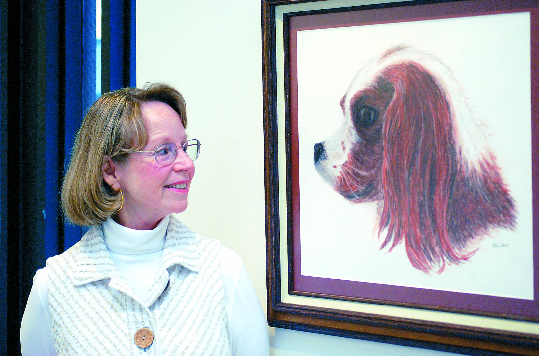 Barbara Van Vorst displays her portrait of Molly