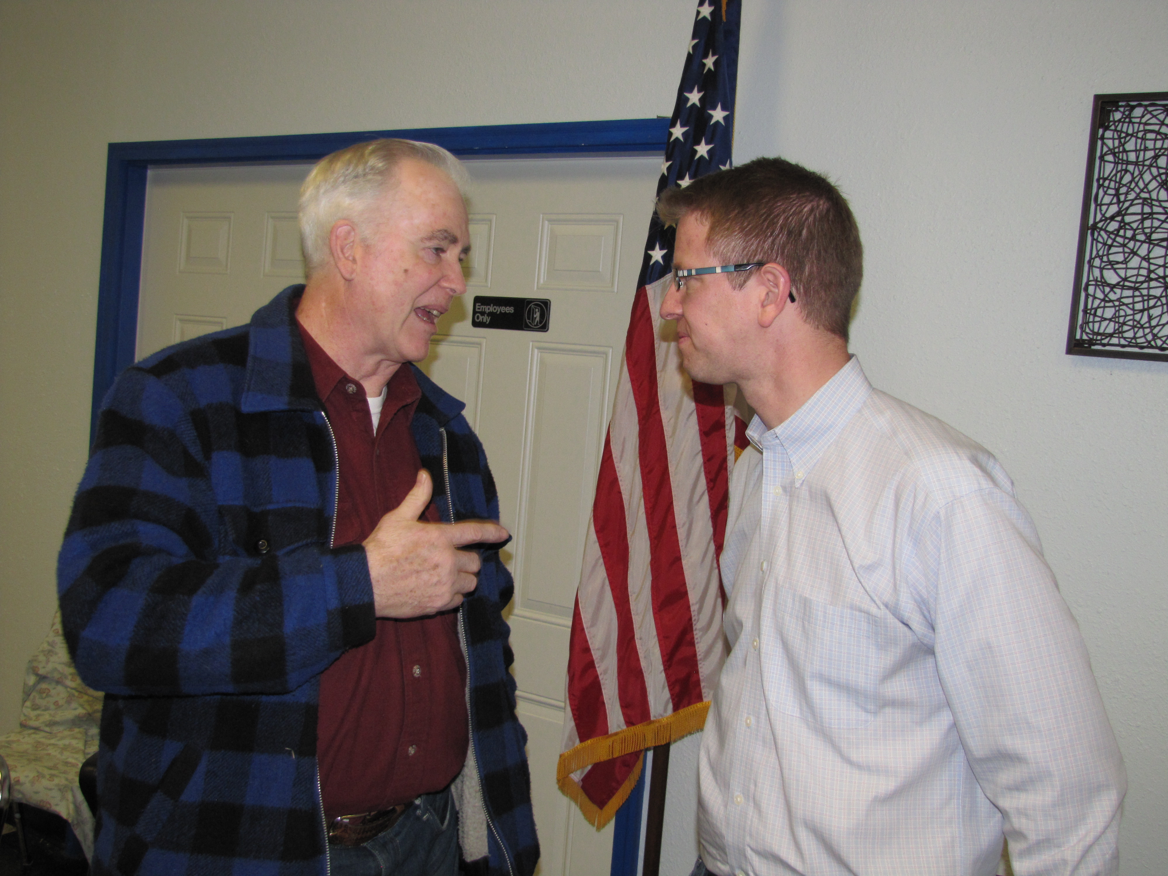 Richard Coulson of Port Angeles talks to Congressman Derek Kilmer about the use of all-terrain vehicles in national forests during a Wednesday visit to Forks