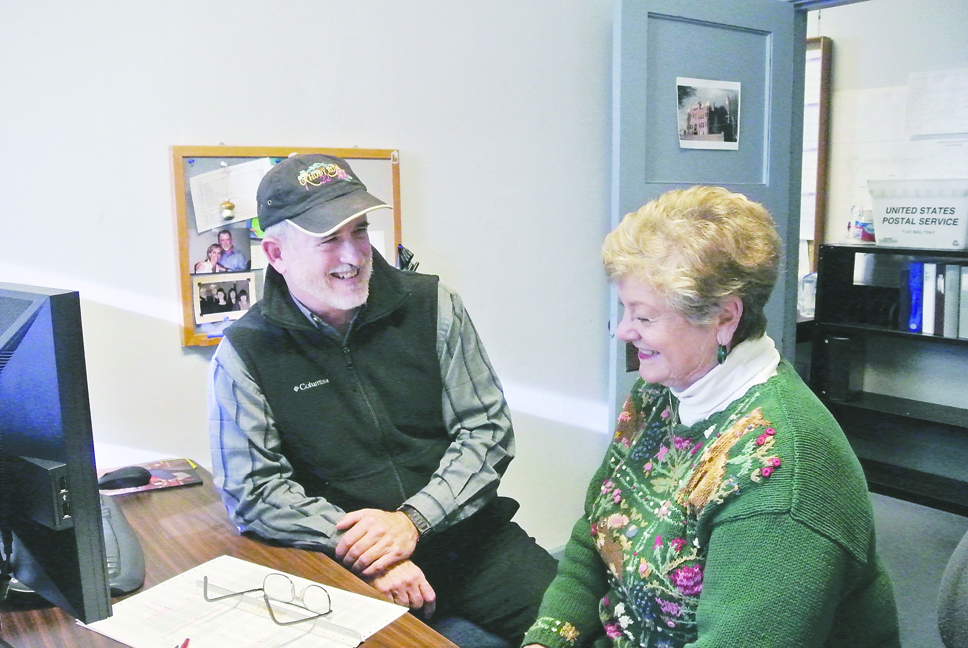 Jefferson County Assessor Jack Westerman III and Treasurer Judi Morris discuss the software upgrade. Charllie Bermant/Peninsula Daily News