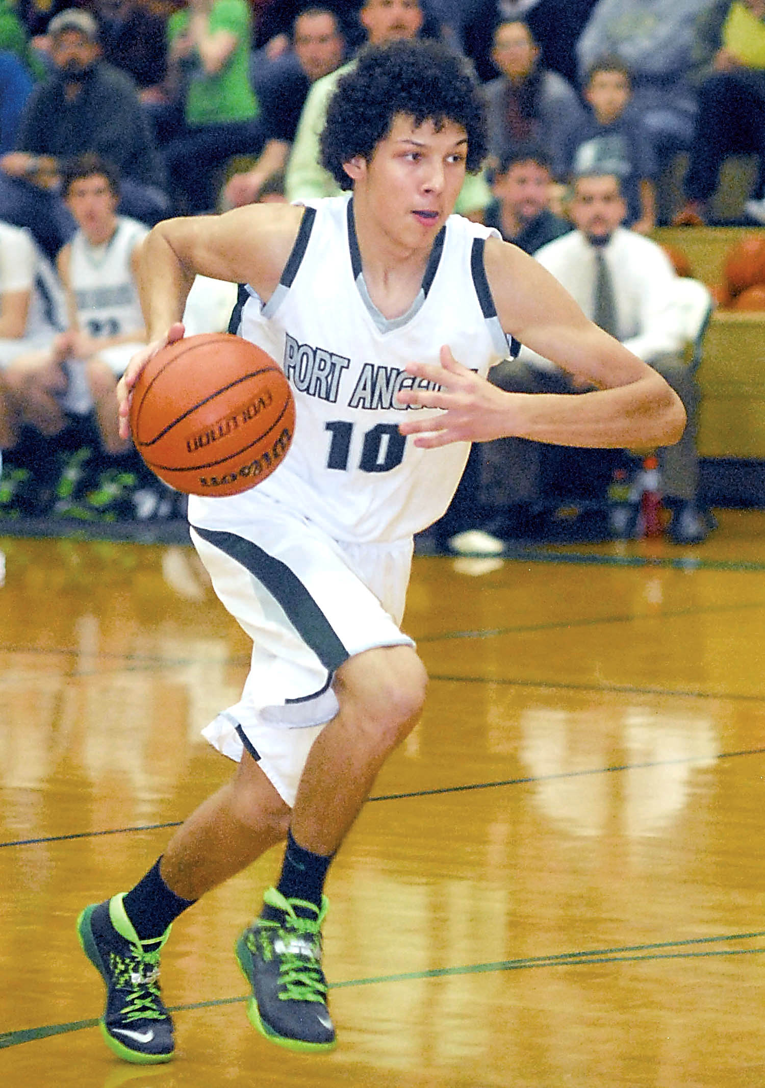 Steven Lauderback of Port Angeles goes for a breakaway dash to the lane during the Roughriders' game against Sequim last month in Port Angeles. Keith Thorpe/Peninsula Daily News