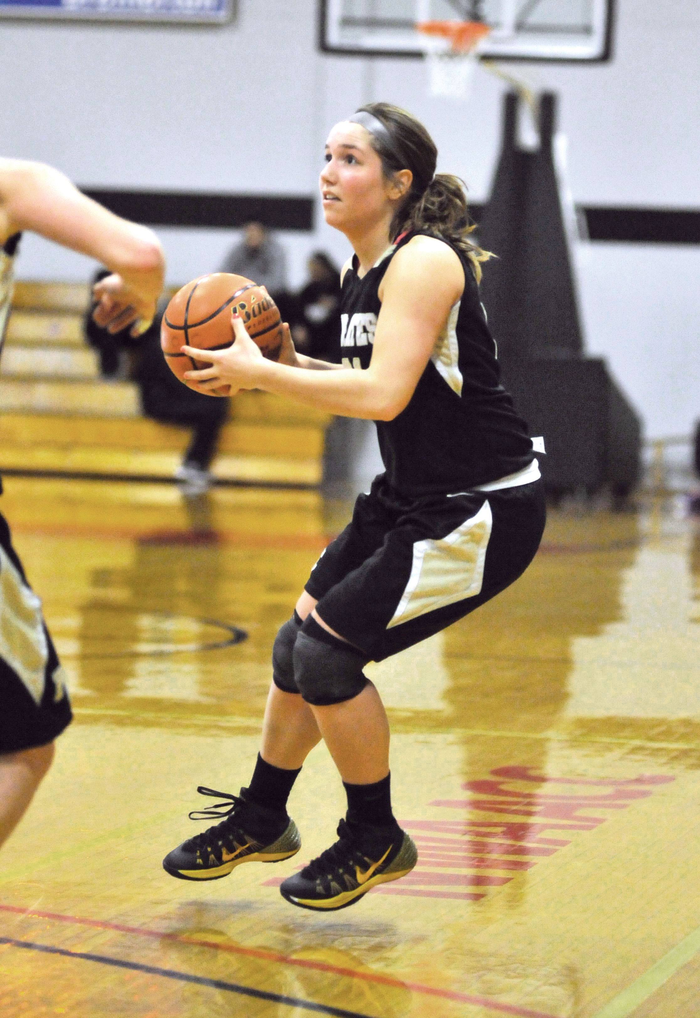 Peninsula's Alison Knowles squares up at the 3-point line. Knowles set a new school single-season record by hitting her 62nd 3-pointer of the year. Jeff Halstead/for Peninsula Daily News