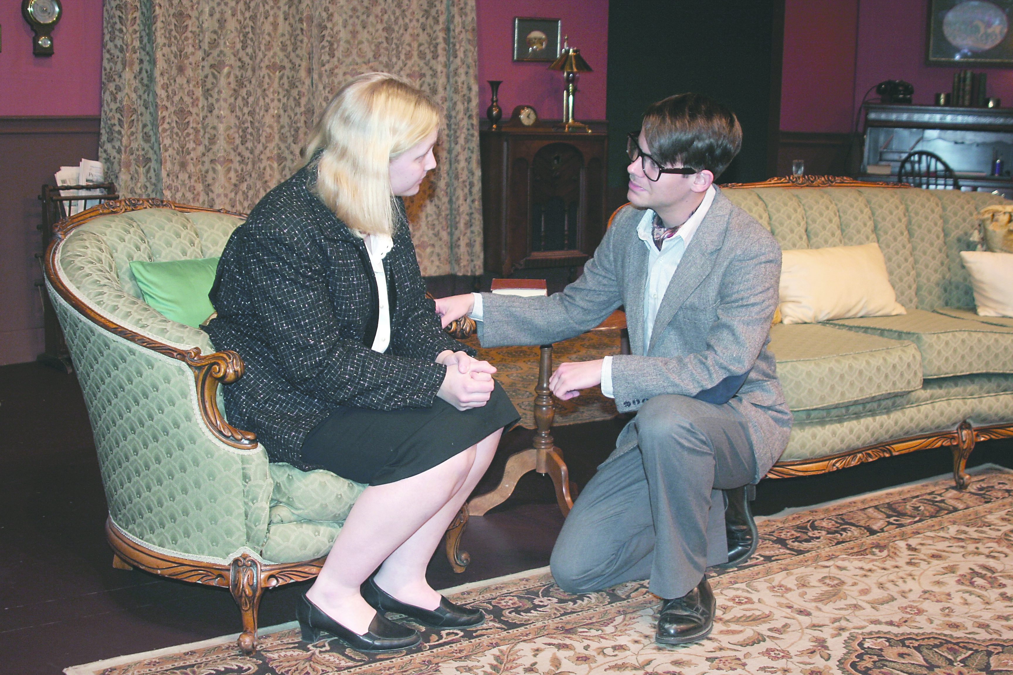 Christopher Wren (Jeremiah Paulsen) seeks to charm Monkswell Manor proprietress Mollie (Erin Henninger). Kate Carter