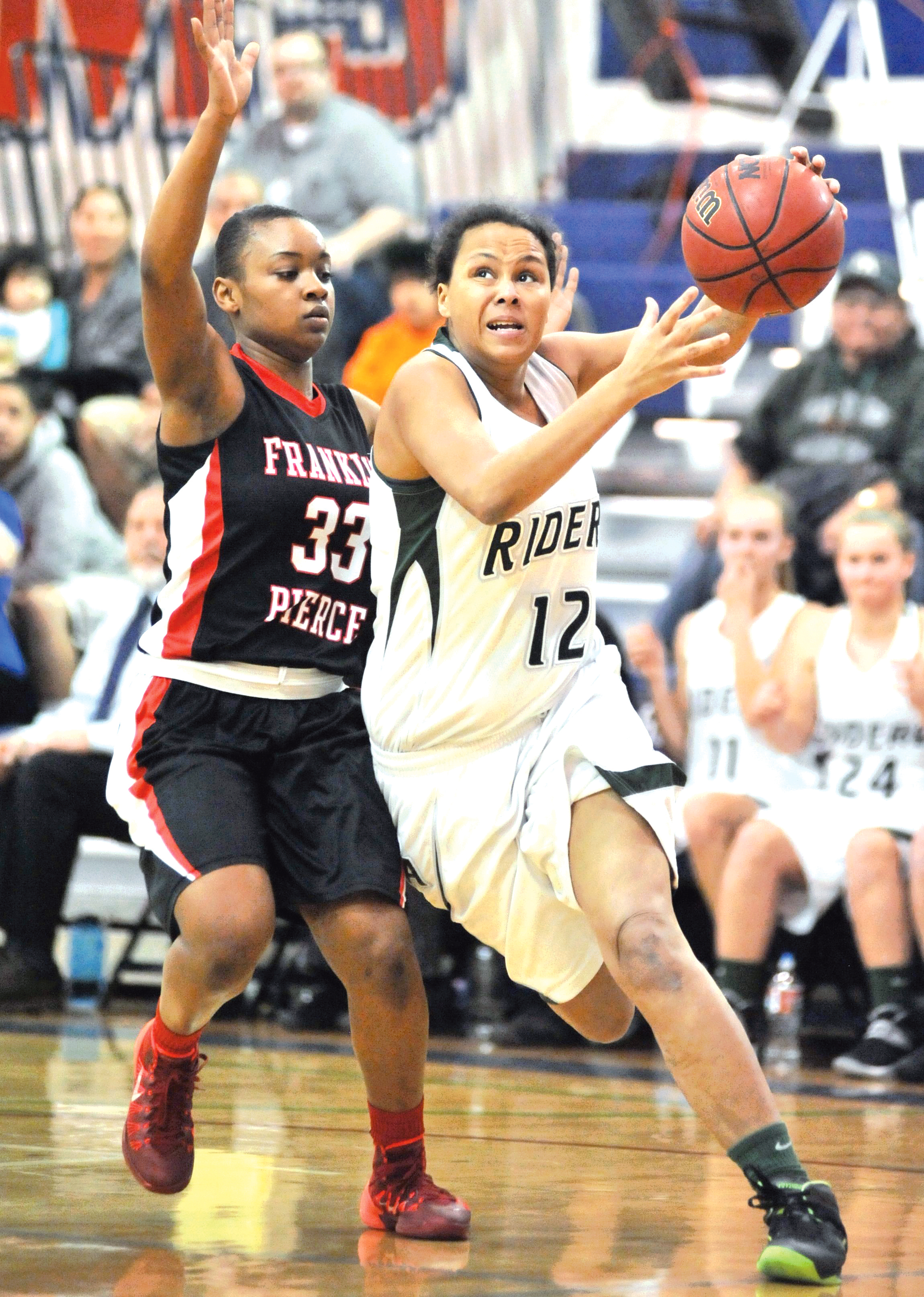 Port Angeles's Lenora Hofer drives past the defense of Franklin Pierce's Gabby Evans during the West Central District tournament last month. Port Angeles opens the 2A state tournament Thursday morning against Lynden. Jeff Halstead/for Peninsula Daily News