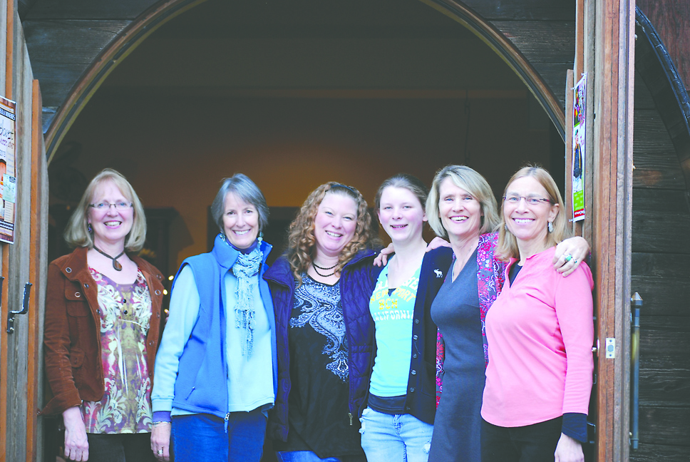 Poised to welcome people to the International Women's Day supper at Olympic Cellars winery Wednesday are