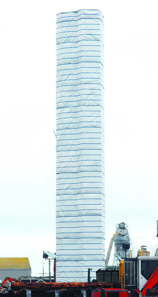 The plastic wrappings may be taken off the Peninsula Plywood stack in Port Angeles starting today in advance of its demolition set for next month. Keith Thorpe/Peninsula Daily News