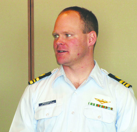 Lt. Cmdr. Edward Geraghty of Coast Guard Air Station/Sector Field Office Port Angeles delivers an update at Monday's Port Angeles Regional Chamber of Commerce meeting. Arwyn Rice/Peninsula Daily News