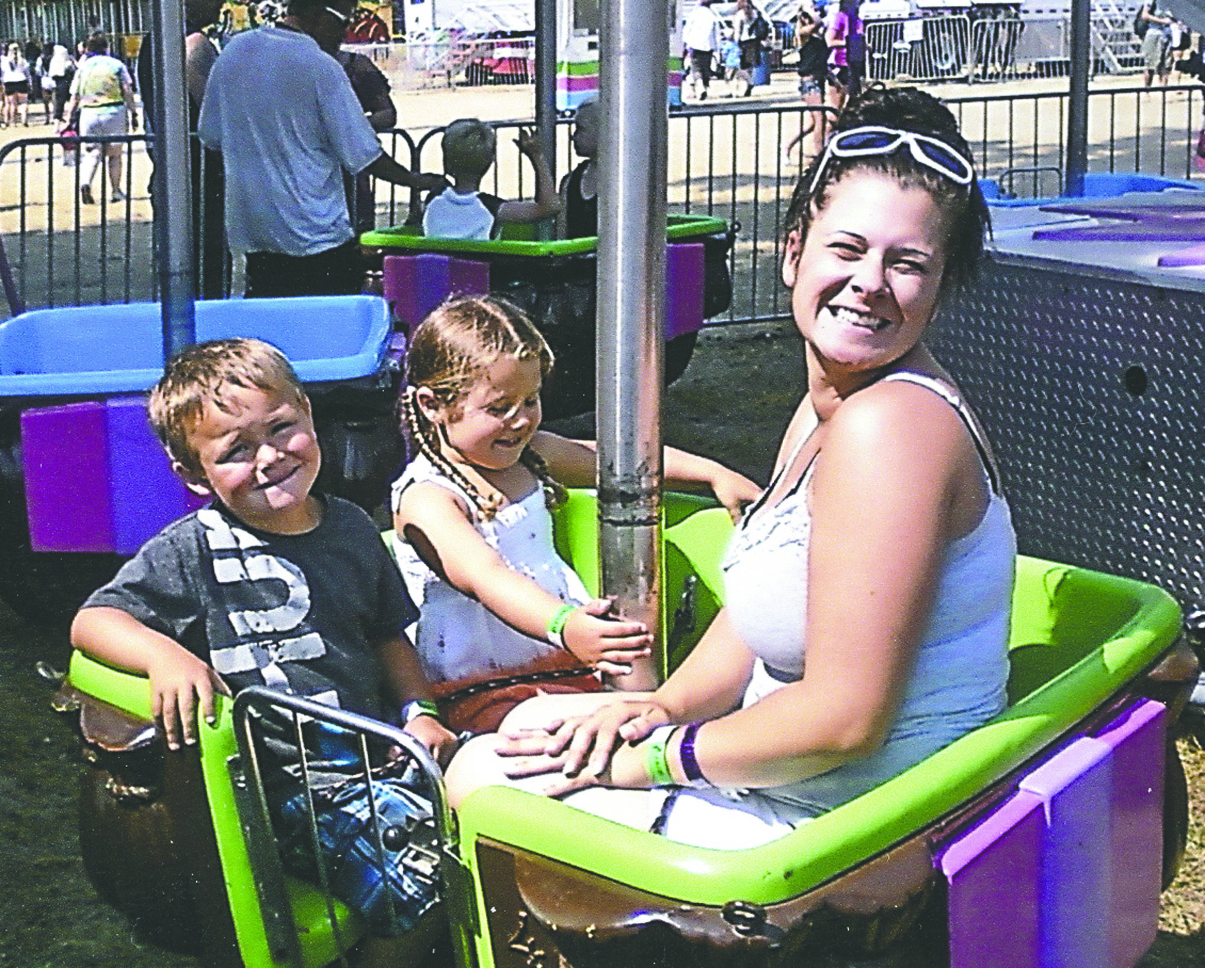 Aamanda LaGambina smiles for this family snapshot at an amusement park as her daughter