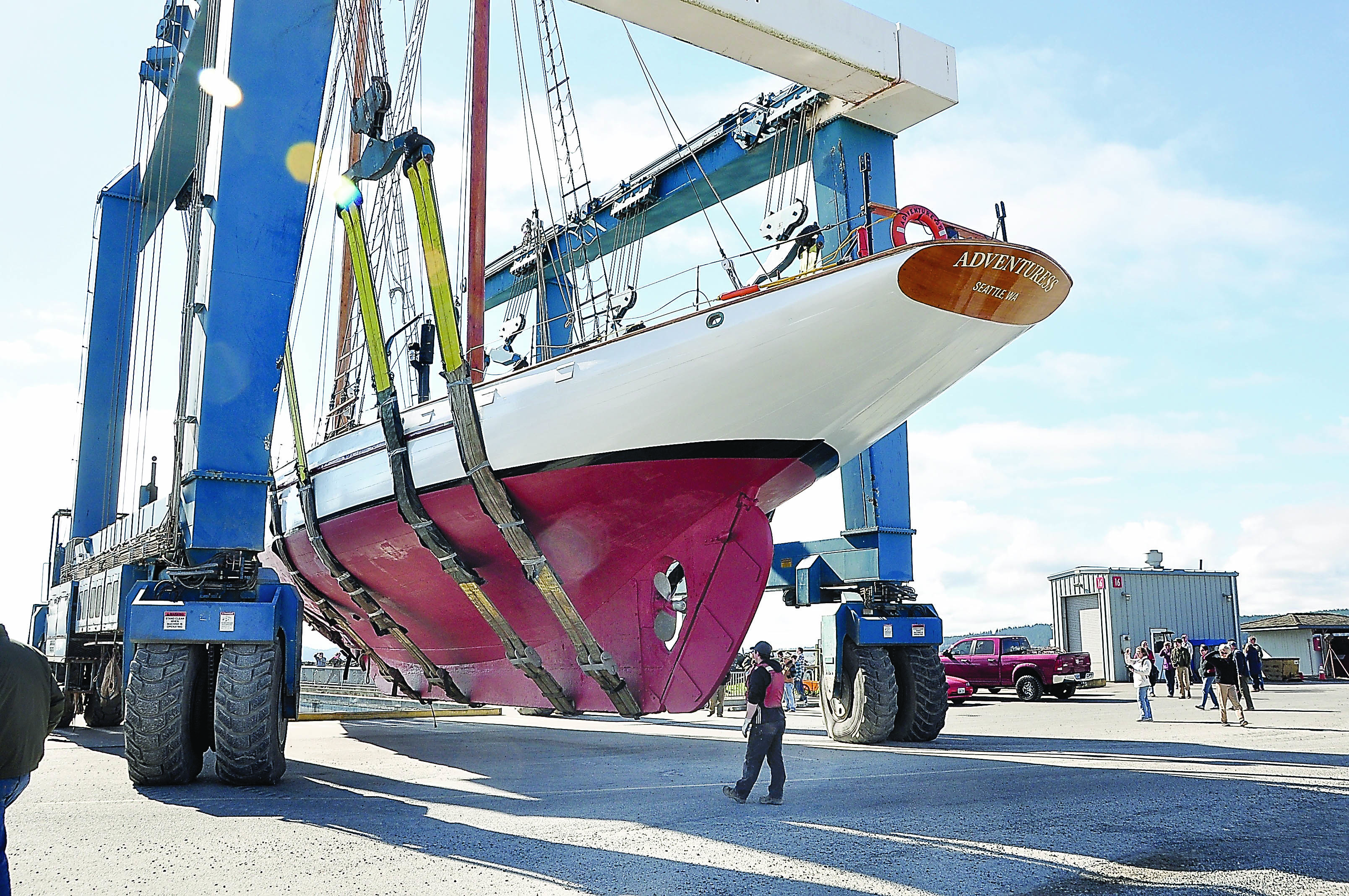 The schooner Adventuress is lifted through the Port Townsend Boat Haven just before being put into the water for the 2014 sailing season. Elizabeth Becker/Sound Experience