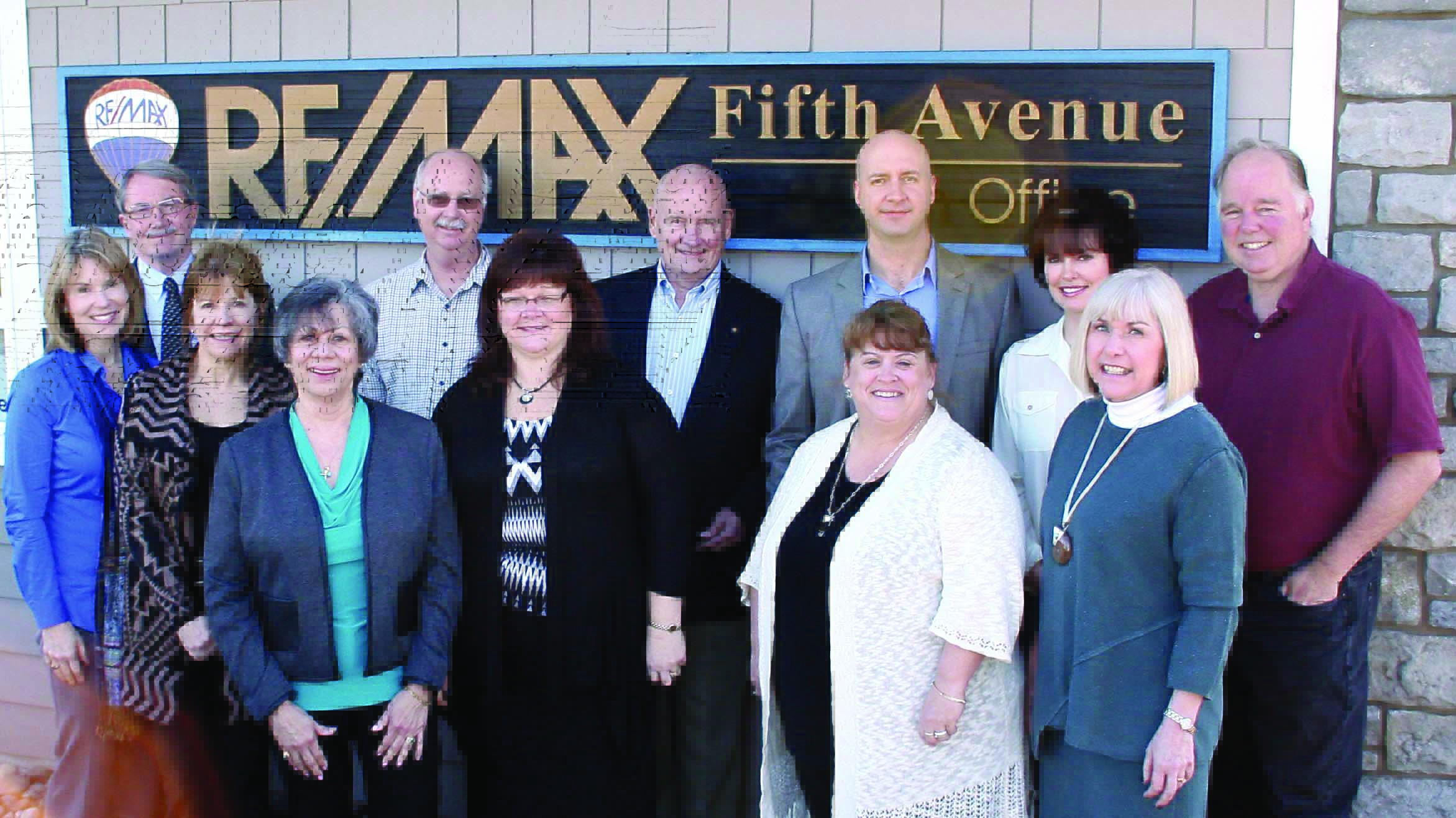RE/MAX Fifth Avenue real estate agency staffers — in front from left