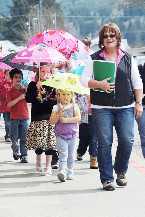 Pat Soderlind leads the Umbrella Parade in downtown Forks during the 2012 RainFest. Lonnie Archibald/for Peninsula Daily News