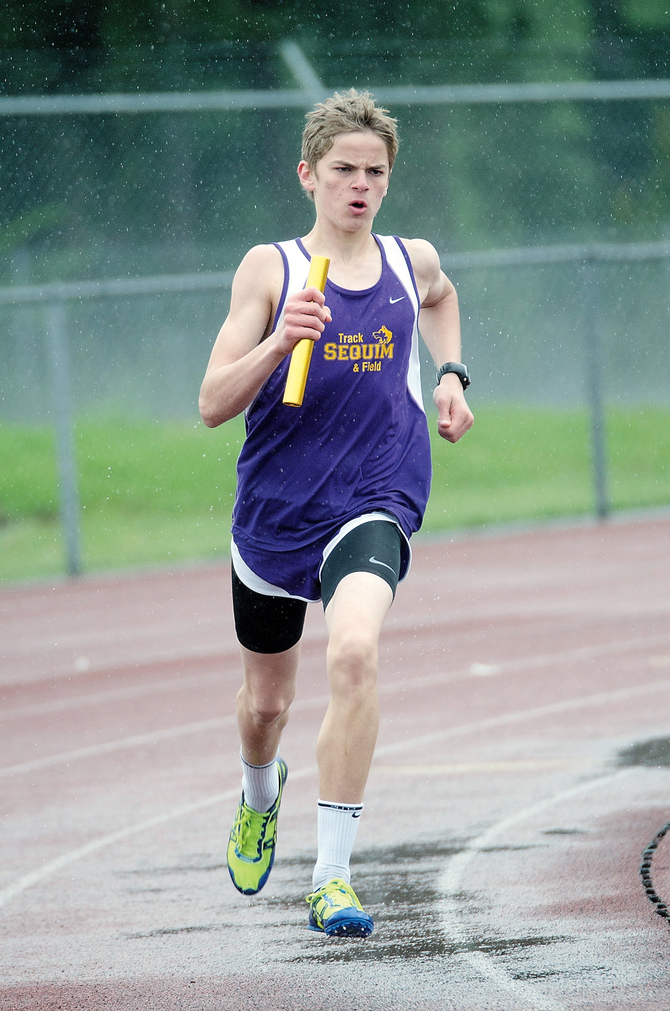 Sequim's Jackson Oliver runs in the 4x400-meter relay at the Add It Up Invitational. Oliver won the high jump. Jesse Major/for Peninsula Daily News