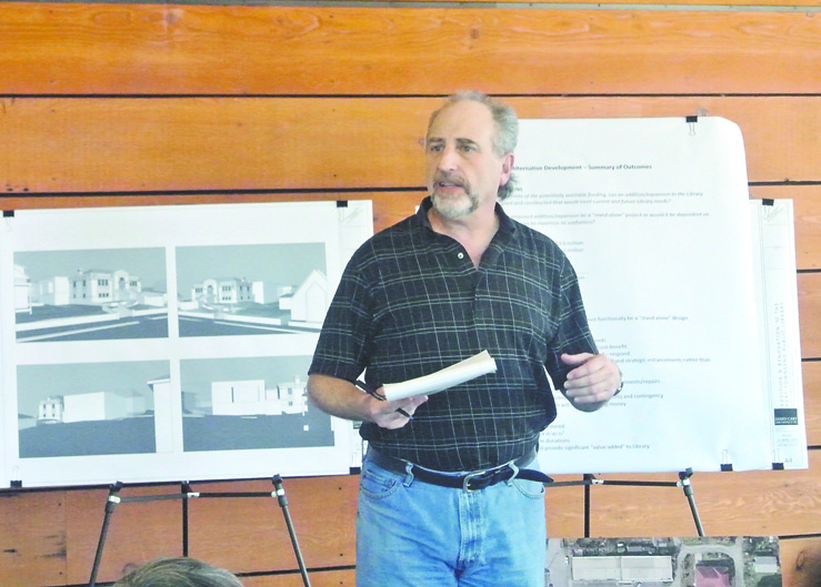 Port Townsend Development Services Director Rick Sepler explains the preferred option for the library's renovation at a meeting on Monday night. Charlie Bermant/Peninsula Daily News
