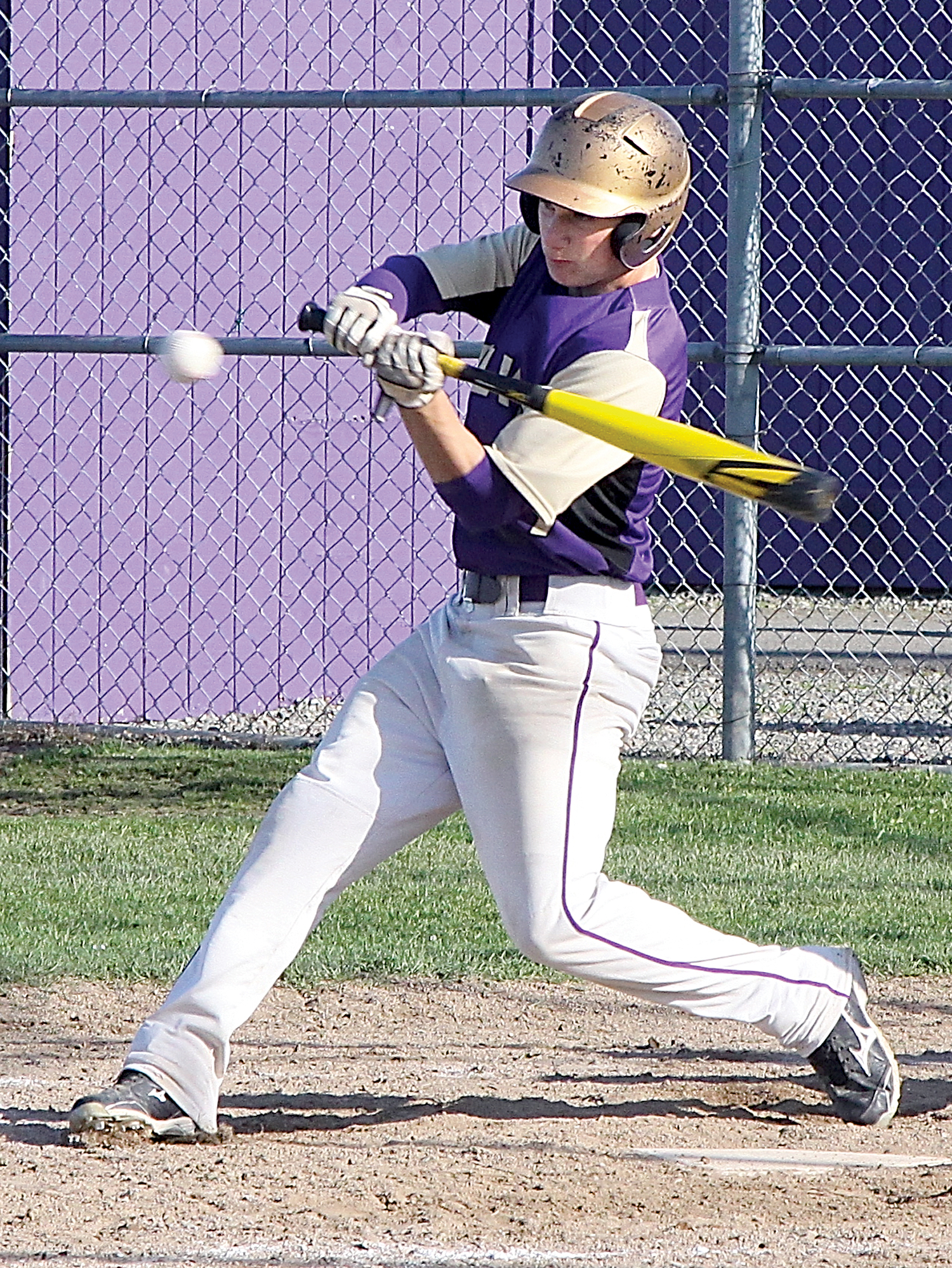 Sequim's Brett Wright swings at a pitch during the Wolves' 8-4 victory over Bremerton. Wright finished with three hits