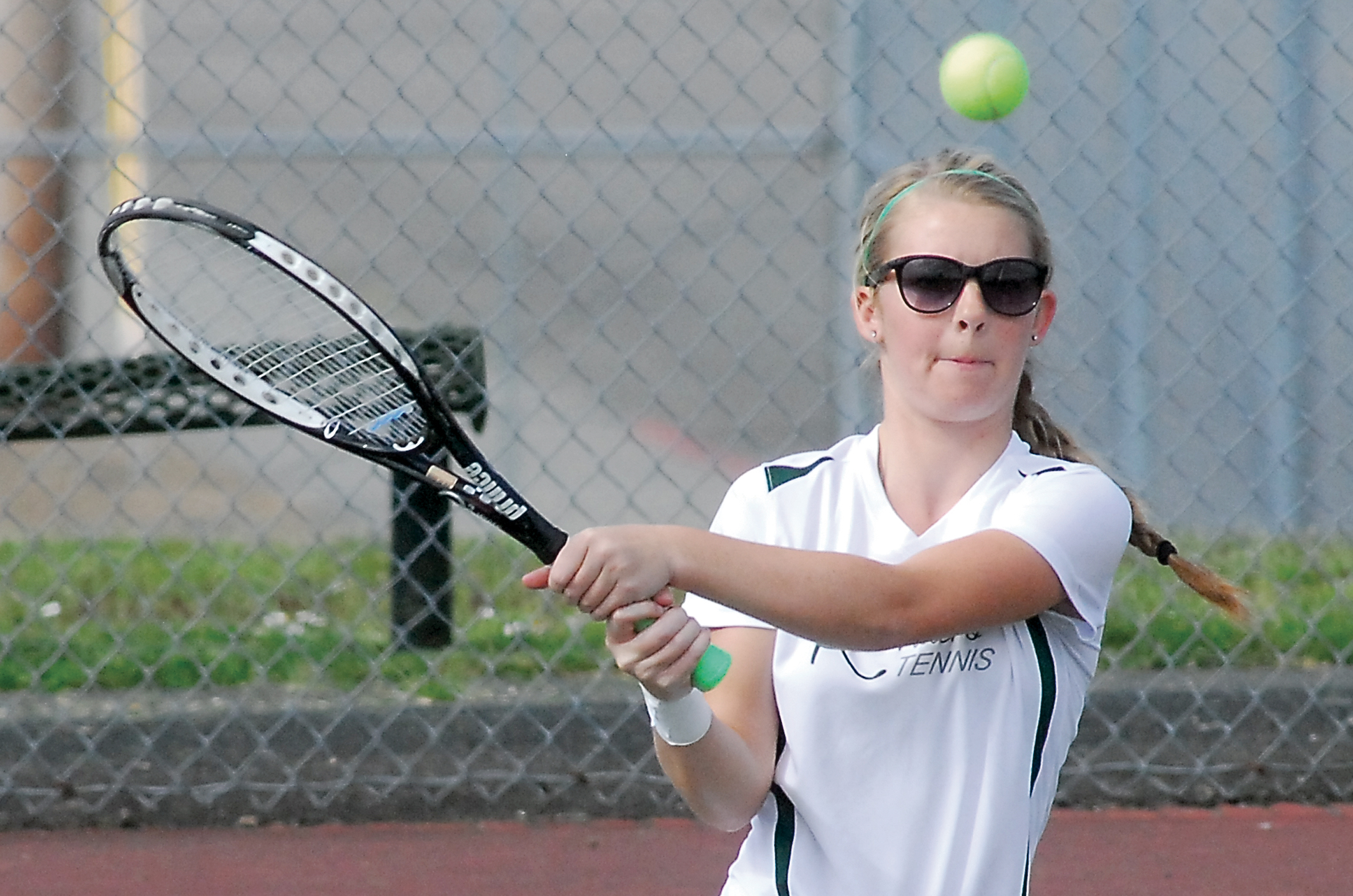 Port Angeles' Callie Peet returns a shot in a match against North Mason's Danielle Bosch at Port Angeles High School. Peet won in straight sets 6-1