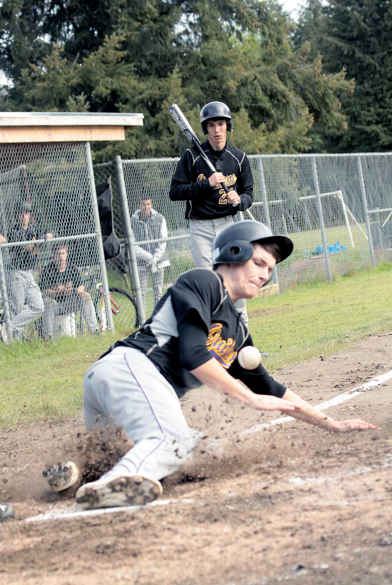 Quilcene's Eli Harrison scores a run in the Rangers' 3-0 Sea-Tac League playoff win against Rainier Christian. Shawn King/for Peninsula Daily News