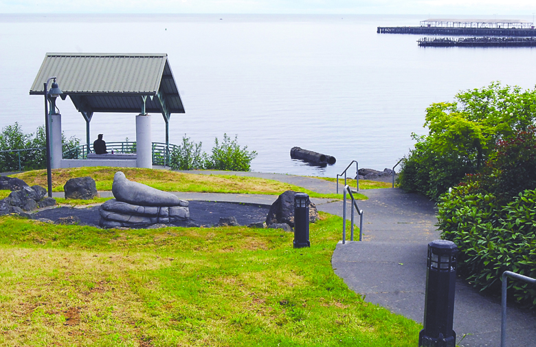 A park user looks out at the water of Port Angeles Harbor from the pavilion at Francis Street Park in Port Angeles on Thursday. The park was reopened Wednesday after being closed for sewer line work as part of the city's combined sewer outflow project. Keith Thorpe/Peninsula Daily News