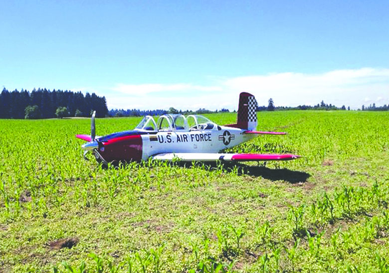 A 1950s-era Beechcraft sits in a cornfield near Camas after making an emergency landing. Clark County Sheriff's Office