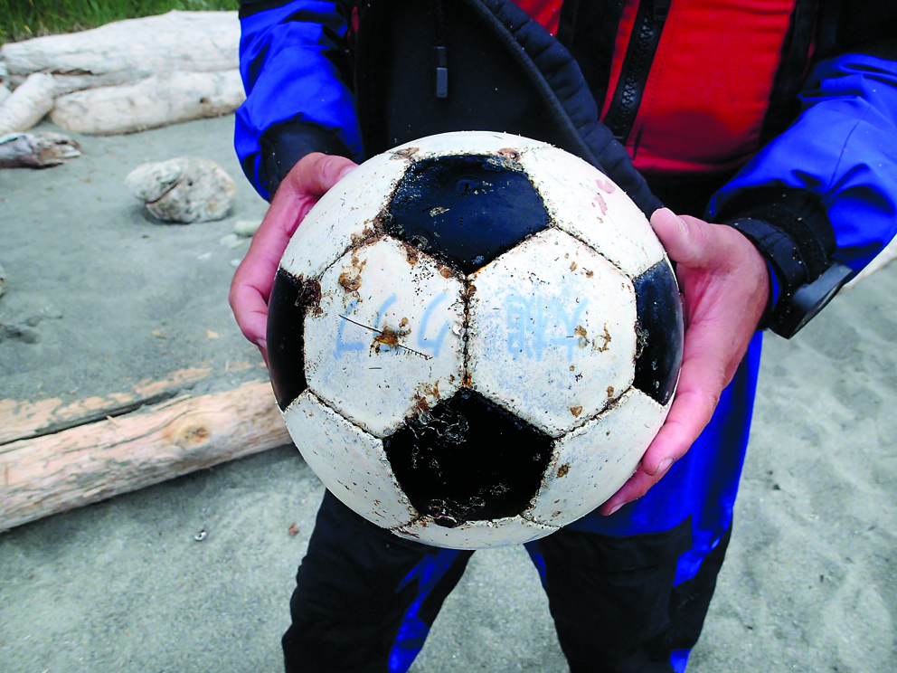 Writing on this ball identifies it as belonging to a Japanese soccer club. Ikkatsu Project