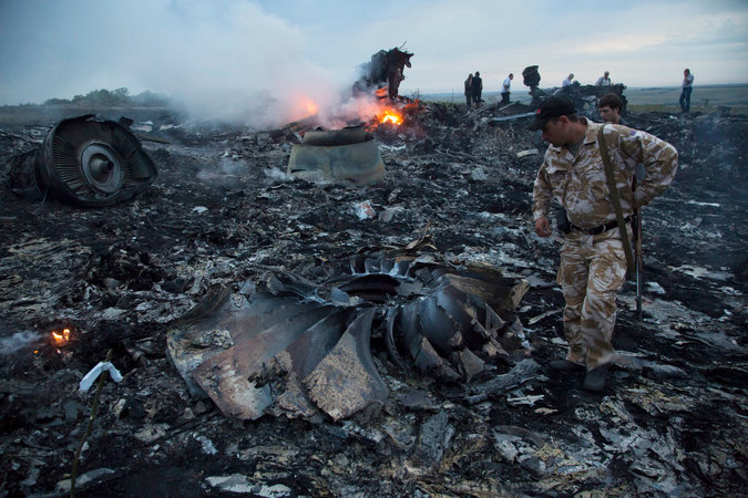 Burned wreckage at the crash site of a Malaysia Airlines 777 carrying 298 people in the Donetsk region of Ukraine. The Associated Press