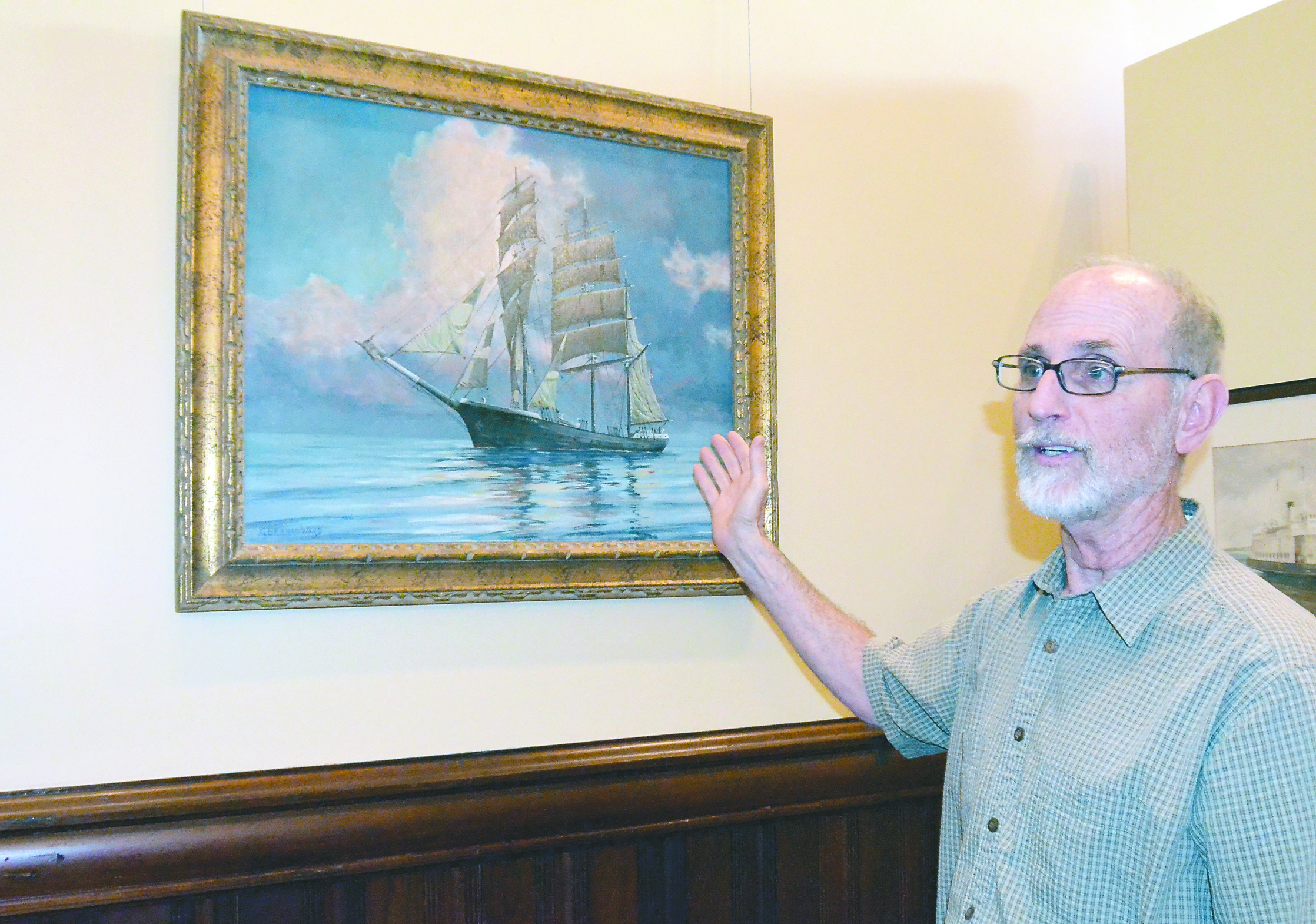 Jefferson County Museum of Art & History Director Bill Tennant with a painting hat will be in the new exhibit opening Saturday. Charlie Bermant/Peninsula Daily News