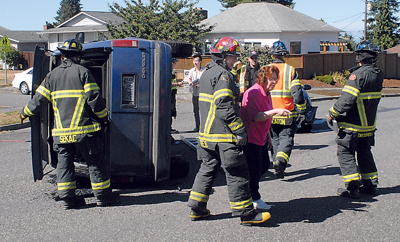 Port Angeles firefighters accompany Toni Thompson