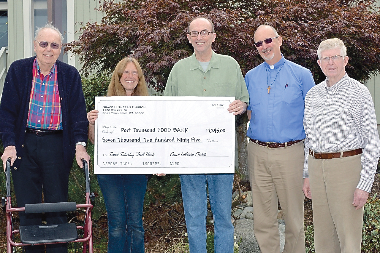 Representatives of Grace Lutheran Church presented a check